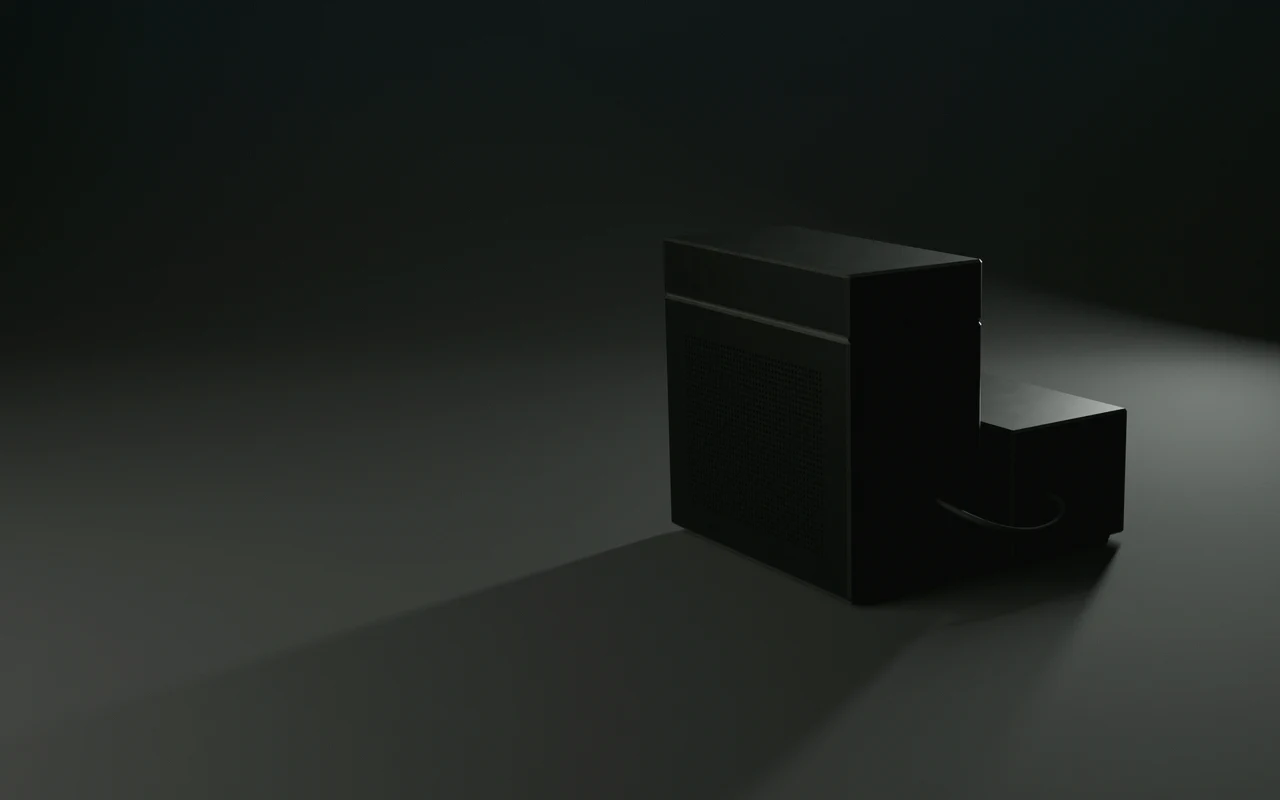 The back of the Gedō workstation at night, lit by its single indicator light